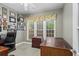Office room featuring natural light, wood trim, and decorative accents at 203 Setters Rdg, Canton, GA 30115