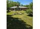 Back yard with rocks and an enclosed patio at 2126 Monterey Dr, Snellville, GA 30039