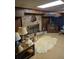Basement with fireplace, wooden walls, lighting fixtures, and a cozy rug at 2126 Monterey Dr, Snellville, GA 30039