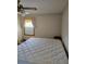 Simple bedroom with a large bed, neutral walls, and a window providing natural light at 2126 Monterey Dr, Snellville, GA 30039