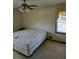Bedroom with a comfortable bed, neutral walls, and a window offering natural light at 2126 Monterey Dr, Snellville, GA 30039