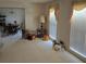 A view of the living room and dining room with large windows at 2126 Monterey Dr, Snellville, GA 30039