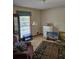 Eclectic living room with unique decor and plenty of natural light from a large window at 2126 Monterey Dr, Snellville, GA 30039