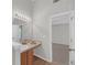 Bathroom featuring vanity, sink, and a doorway leading to a bedroom at 2640 Thunder Basin Way, Douglasville, GA 30135