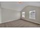 Spacious bedroom with a vaulted ceiling, plush carpeting, and two windows, offering plenty of natural light at 2640 Thunder Basin Way, Douglasville, GA 30135
