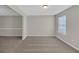 Neutral dining room showcasing neutral carpet, light gray walls with bright window, and classic trim at 2640 Thunder Basin Way, Douglasville, GA 30135