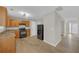 Functional kitchen with wood cabinets, black appliances, and wood flooring, offering a practical cooking space at 2640 Thunder Basin Way, Douglasville, GA 30135