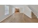Open floor plan featuring living room leading to kitchen and staircase at 2640 Thunder Basin Way, Douglasville, GA 30135