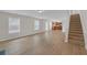 Open floor plan featuring living room leading to kitchen and staircase at 2640 Thunder Basin Way, Douglasville, GA 30135