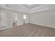 Spacious primary bedroom with trey ceiling and carpet at 2640 Thunder Basin Way, Douglasville, GA 30135