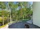 Landscaped backyard with mature trees providing a peaceful outdoor retreat and fire pit at 3290 Dunlop Ne Ct, Atlanta, GA 30319