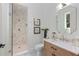 Modern bathroom with tiled shower, unique vanity, and elegant fixtures at 3290 Dunlop Ne Ct, Atlanta, GA 30319