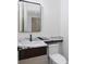 Powder room with sleek marble countertop, vessel sink and modern black fixtures, offering style and functionality at 3290 Dunlop Ne Ct, Atlanta, GA 30319