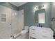 Stylish bathroom featuring a glass-enclosed shower and sleek vanity with modern fixtures at 3290 Dunlop Ne Ct, Atlanta, GA 30319