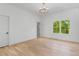 Elegant bedroom with a window view and decorative crown molding and door at 3290 Dunlop Ne Ct, Atlanta, GA 30319