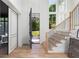 Inviting foyer with hardwood floors, staircase, and an open view to the exterior, bathed in natural light at 3290 Dunlop Ne Ct, Atlanta, GA 30319