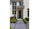 Inviting front entrance with a stone walkway, manicured landscaping, and modern exterior lighting at 3290 Dunlop Ne Ct, Atlanta, GA 30319