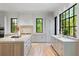 Spacious kitchen with a large center island, stainless appliances, stone countertops, and lots of natural light at 3290 Dunlop Ne Ct, Atlanta, GA 30319