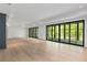 Spacious living room with expansive sliding glass doors offering views of the lush, green outdoors at 3290 Dunlop Ne Ct, Atlanta, GA 30319