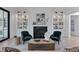 Living room with a fireplace, built-in shelves, and plush seating at 3290 Dunlop Ne Ct, Atlanta, GA 30319