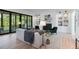 Cozy living room featuring a fireplace, custom shelving, and a large window view at 3290 Dunlop Ne Ct, Atlanta, GA 30319