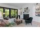 Stylish living room with hardwood floors, fireplace, and expansive outdoor views at 3290 Dunlop Ne Ct, Atlanta, GA 30319