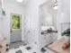 Mudroom with patterned tile floors, wainscoting, and custom built-in cabinets at 3290 Dunlop Ne Ct, Atlanta, GA 30319