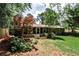 Large backyard with a lush lawn and a sunroom addition, perfect for outdoor enjoyment at 1280 Berkeley Rd, Avondale Estates, GA 30002