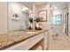 Bathroom featuring granite counters, updated fixtures, and tiled shower at 1280 Berkeley Rd, Avondale Estates, GA 30002