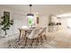 Inviting dining area featuring modern lighting and a stylish rug at 1280 Berkeley Rd, Avondale Estates, GA 30002