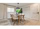 Bright dining area features a modern table setting, stylish lighting, and a view into the adjacent living space at 1280 Berkeley Rd, Avondale Estates, GA 30002