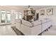 Bright living space with a stone fireplace, modern decor, and glass doors creating a seamless indoor-outdoor flow at 1280 Berkeley Rd, Avondale Estates, GA 30002