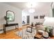 Bright living room featuring hardwood floors, a modern rug, and neutral decor creating a cozy ambiance at 1280 Berkeley Rd, Avondale Estates, GA 30002