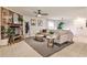 Spacious living room with a stone fireplace, neutral tones, and contemporary decor, ideal for relaxation at 1280 Berkeley Rd, Avondale Estates, GA 30002