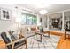 Cozy living room with hardwood floors, plush seating, and views into the Gathering room at 1280 Berkeley Rd, Avondale Estates, GA 30002