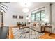 Inviting living area with large windows, stylish decor, and hardwood floors offering a comfortable setting at 1280 Berkeley Rd, Avondale Estates, GA 30002