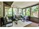 Cozy sunroom featuring comfortable seating, large windows, and a brick floor, perfect for relaxation at 1280 Berkeley Rd, Avondale Estates, GA 30002