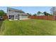 Expansive backyard with lush green grass, a wooden fence, a patio area, and a fire pit perfect for entertaining at 2154 Windstream Sw Way, Marietta, GA 30060