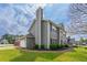 A two-story home boasts a well-manicured lawn and lush landscaping, enhancing its curb appeal and charm at 2154 Windstream Sw Way, Marietta, GA 30060