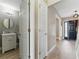 Welcoming hallway with a half-bath and a stylish front door at 2154 Windstream Sw Way, Marietta, GA 30060