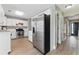 Well-lit kitchen featuring stainless steel appliances, white cabinets, and modern fixtures at 2154 Windstream Sw Way, Marietta, GA 30060