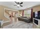Spacious living room with hardwood floors, a staircase, a comfortable sofa, and plenty of natural light at 2154 Windstream Sw Way, Marietta, GA 30060