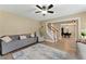 Inviting living room featuring a ceiling fan, neutral paint colors, and stairs at 2154 Windstream Sw Way, Marietta, GA 30060