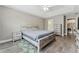 Large main bedroom featuring a ceiling fan, modern décor, and an attached bathroom at 2154 Windstream Sw Way, Marietta, GA 30060