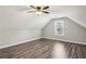 Bright bedroom featuring wood-look floors, ceiling fan and natural light at 2461 Peregrine Trl, Suwanee, GA 30024