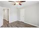 Bedroom featuring wood-look floors, neutral colors and a closet at 2461 Peregrine Trl, Suwanee, GA 30024