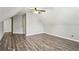 Bedroom featuring wood-look floors, neutral colors, and bright natural light at 2461 Peregrine Trl, Suwanee, GA 30024