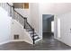 Open foyer features hardwood floors and an open staircase, as well as natural light at 2461 Peregrine Trl, Suwanee, GA 30024