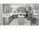 Kitchen featuring stainless steel appliances, island, and ample counter space for cooking at 2461 Peregrine Trl, Suwanee, GA 30024