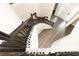 Beautiful staircase with dark wood and iron balusters, connecting multiple floors of the house at 2461 Peregrine Trl, Suwanee, GA 30024